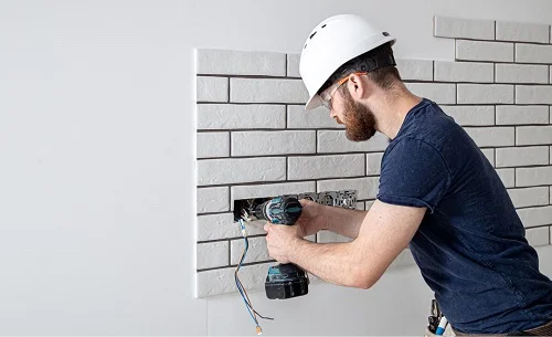 electrician in Fresno County ca installing electrical sockets