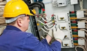 commercial-electrician-repairing-industrial-electrical-panel